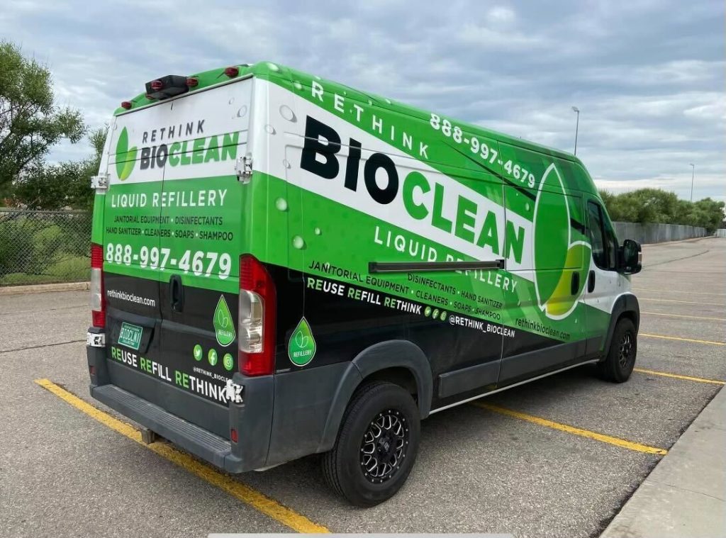 ReThink BioClean's refillery van with green and black decals on the side.