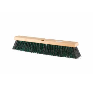 A wooden push broom head with dark coloured bristles.